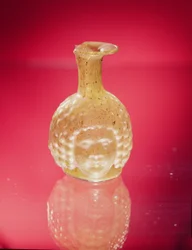 Frasco con cabeza de Jano, siglo III d.C.